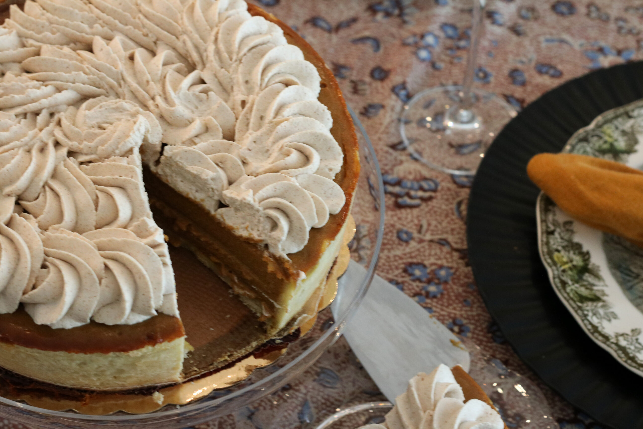 A cream-topped dessert on a festive table
